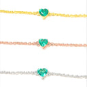 Natural emerald heart bracelets in yellow gold, rose gold and white rhodium plated 925 sterling silver, each with a 5mm heart-cut Zambian emerald