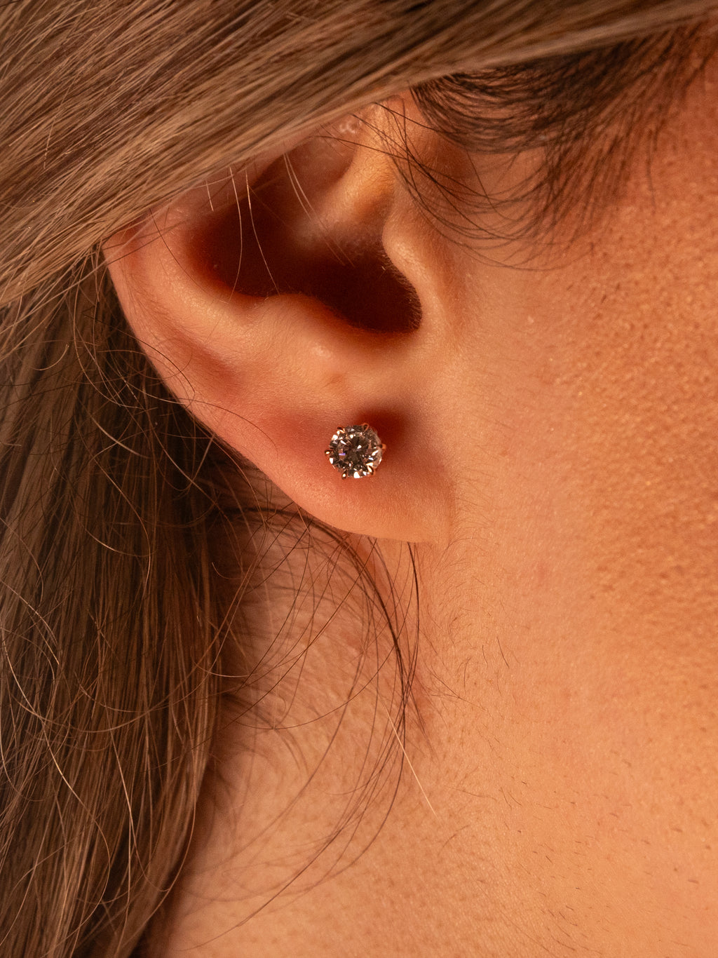 Lab-grown diamond stud earring worn on the earlobe