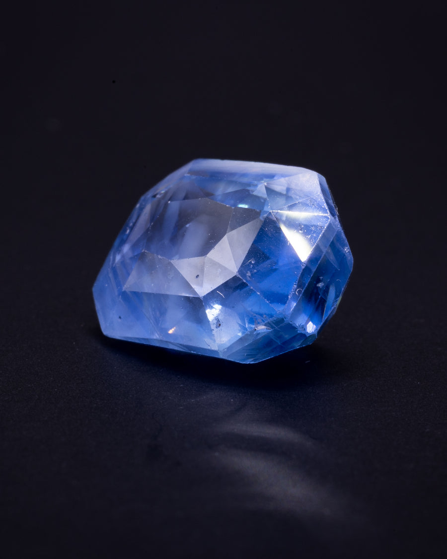 10.01 ct unheated cornflower blue Ceylon sapphire, cushion, on a black background