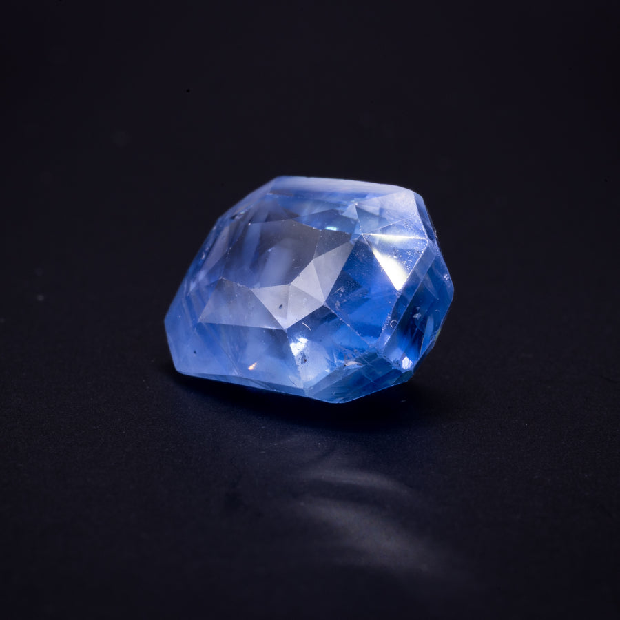10.01 ct unheated cornflower blue Ceylon sapphire, cushion, on a black background