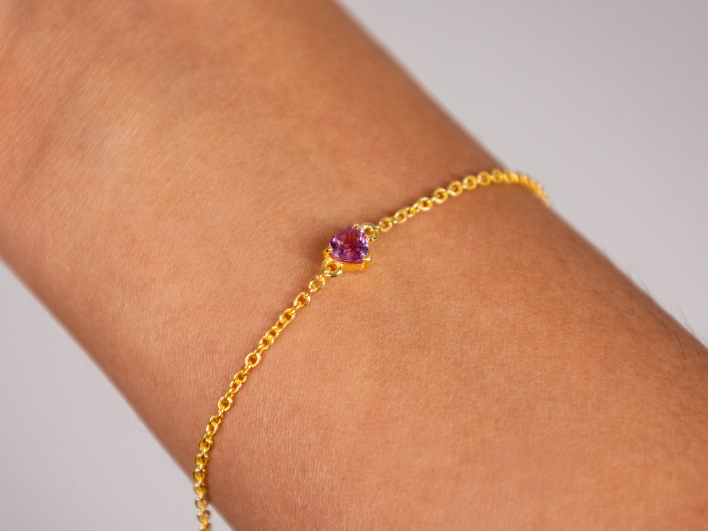 Pink sapphire heart bracelet worn on the wrist, 925 silver with yellow gold plating