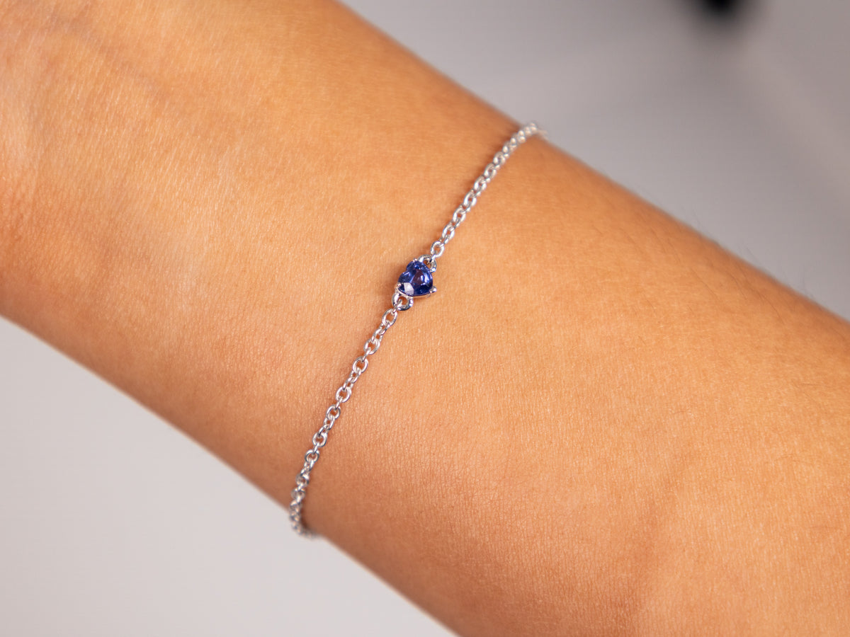 Blue sapphire heart bracelet on the wrist, 4 mm natural heart in white rhodium plated 925 silver