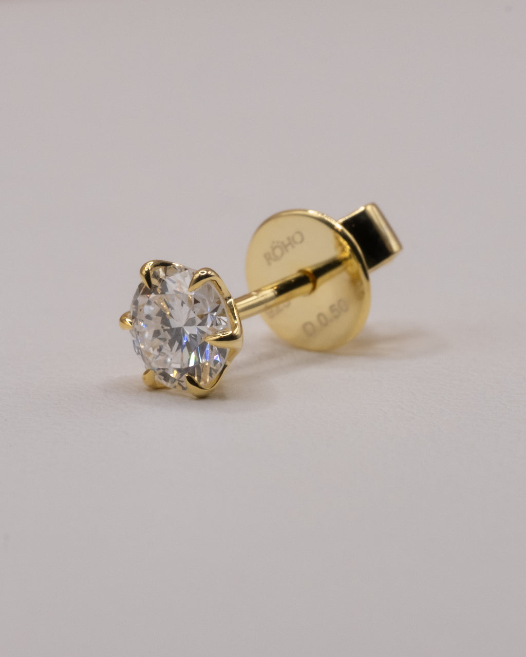Side view of a lab-grown diamond stud in yellow gold plated 925 silver with push back
