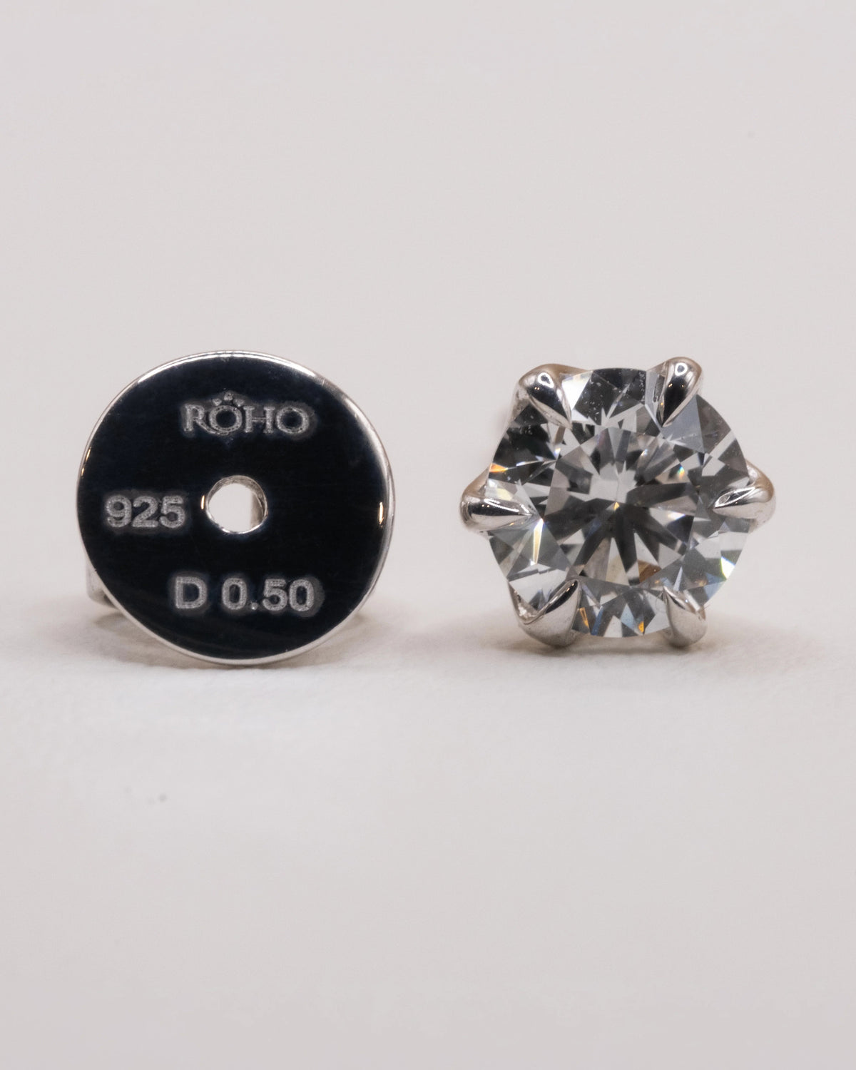 Earring back stamped ROHO 925 D 0.50 beside the white rhodium stud