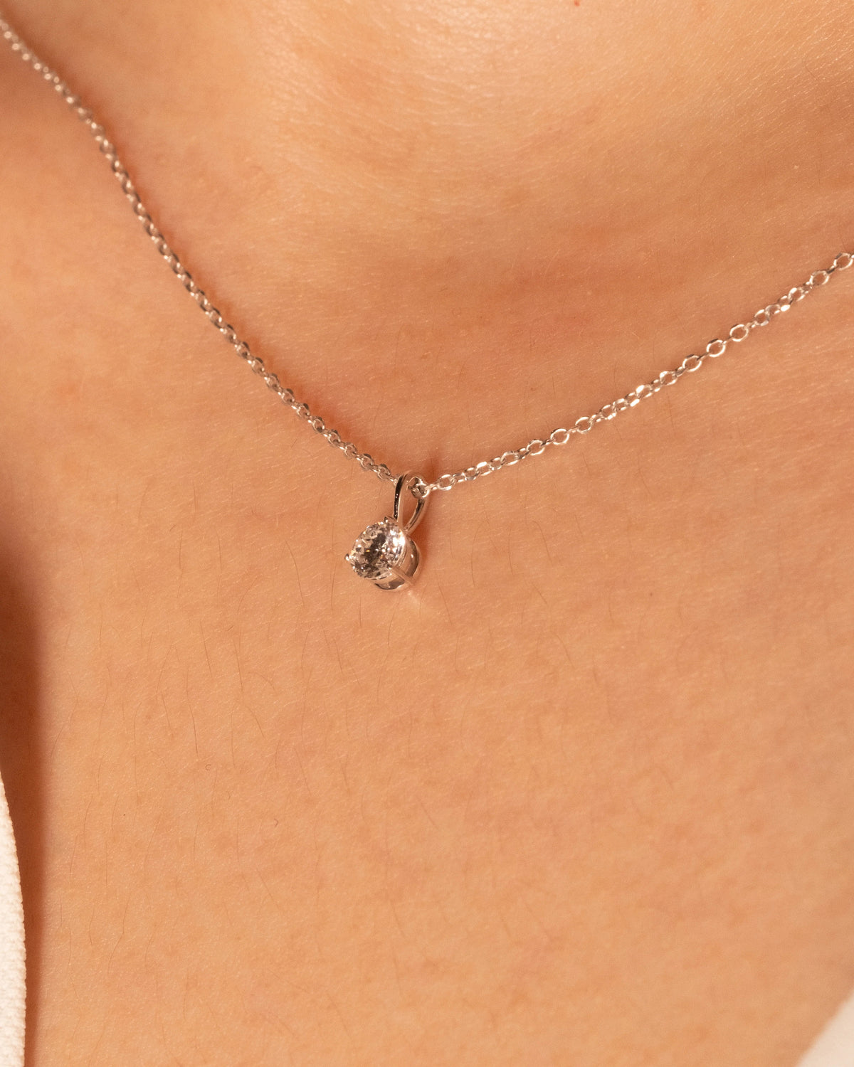0.50 ct solitaire necklace in white rhodium plated 925 silver, worn