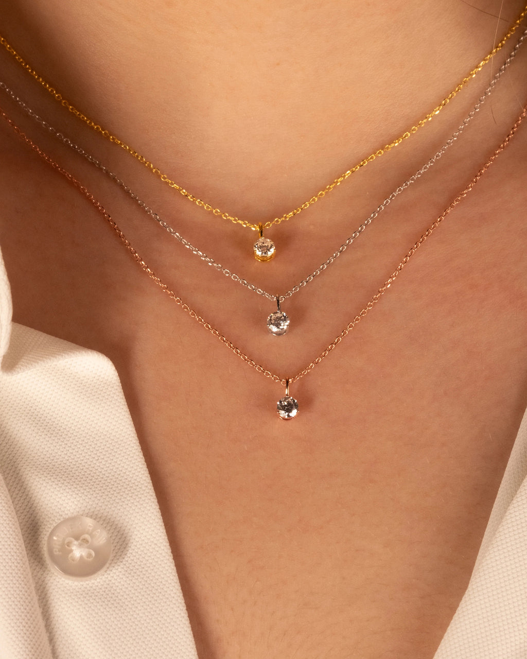 0.50 ct solitaire necklaces in white, rose and yellow gold plated silver, layered and worn