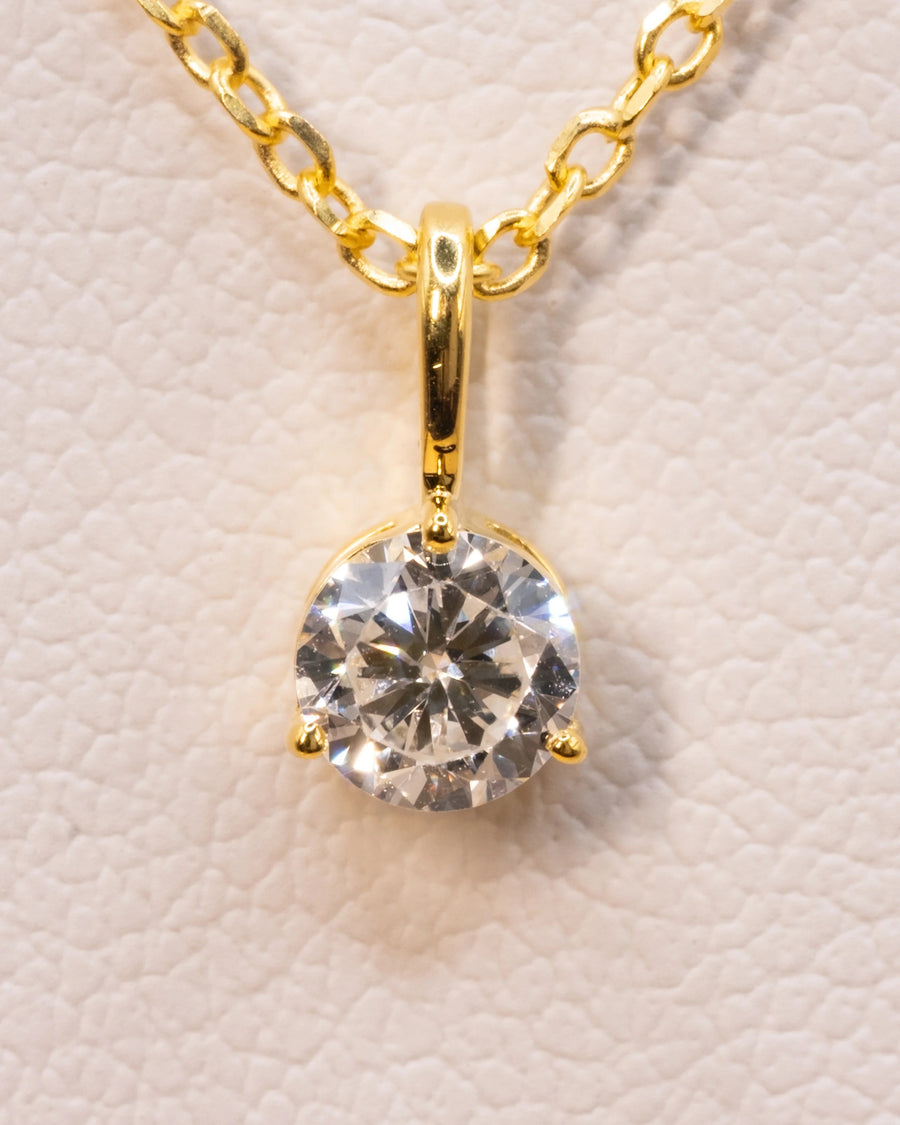 Close up of the 0.50 ct lab-grown diamond pendant in a yellow gold plated setting