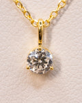 Close up of the 0.50 ct lab-grown diamond pendant in a yellow gold plated setting