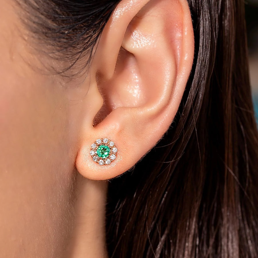 Zambian emerald and diamond halo stud worn on the ear, shown to scale