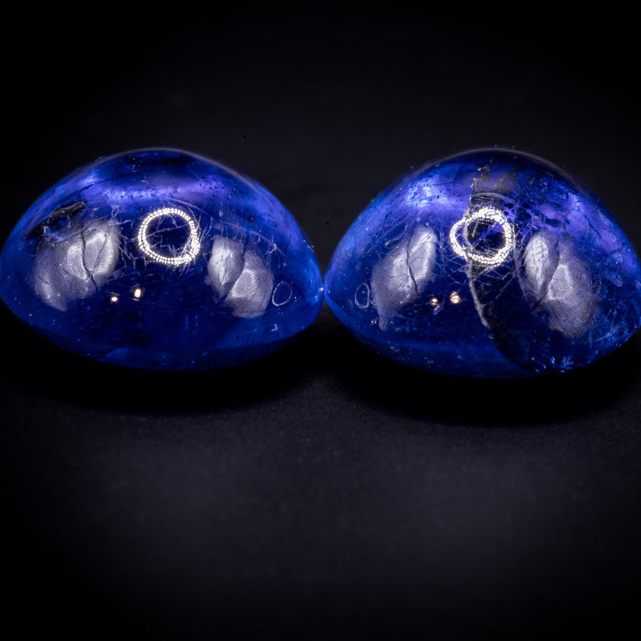 7.90 ct glass-filled blue sapphire cabochon pair, 9x7 mm ovals