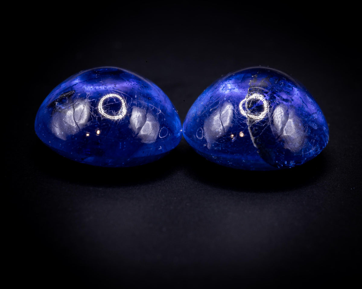 7.90 ct glass-filled blue sapphire cabochon pair, 9x7 mm ovals