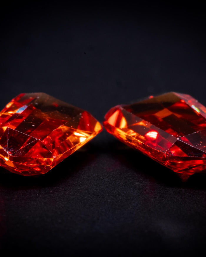 1.55 ct vintage orange sapphire pair, tapered baguettes