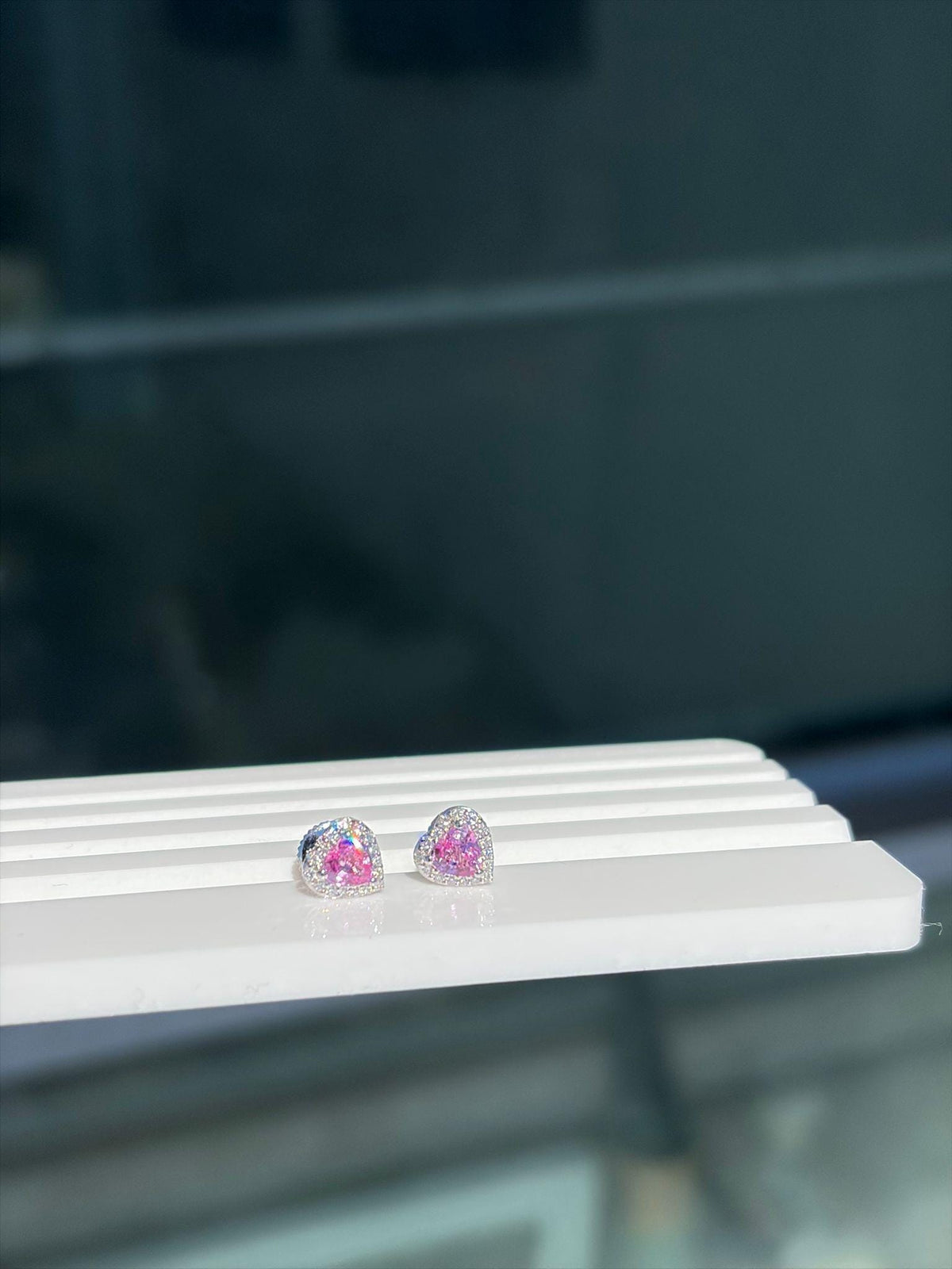 Small pink sapphire and diamond heart stud earrings in 18K white gold, view 2