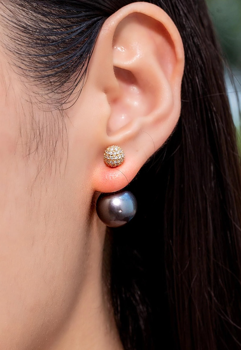 Tahitian pearl and diamond front-back earring in 18K yellow gold, worn on the ear