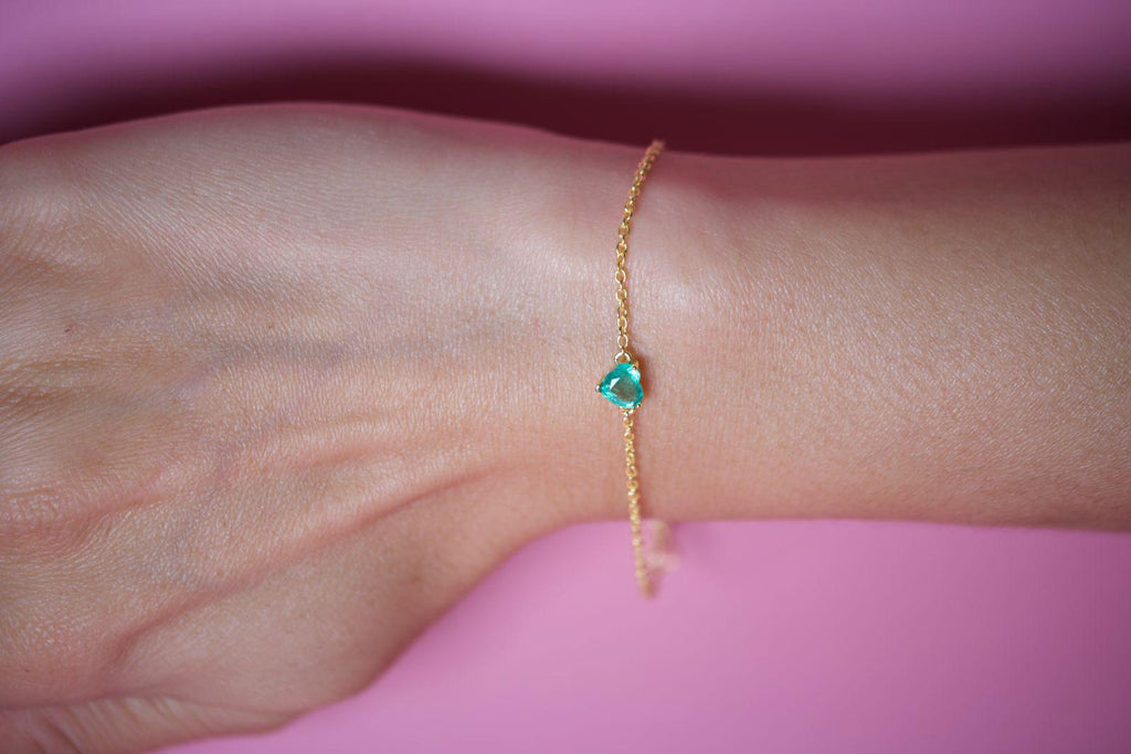 Natural emerald heart bracelet worn on the wrist, yellow gold plated sterling silver
