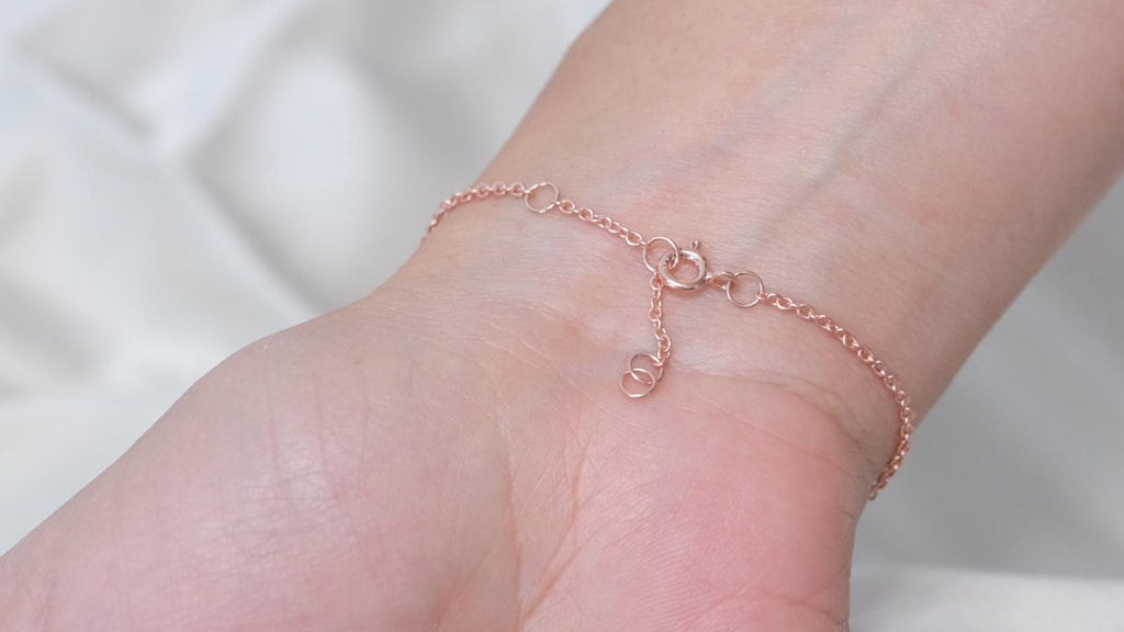 Spring ring clasp and adjustment rings on the rose gold plated emerald heart bracelet chain