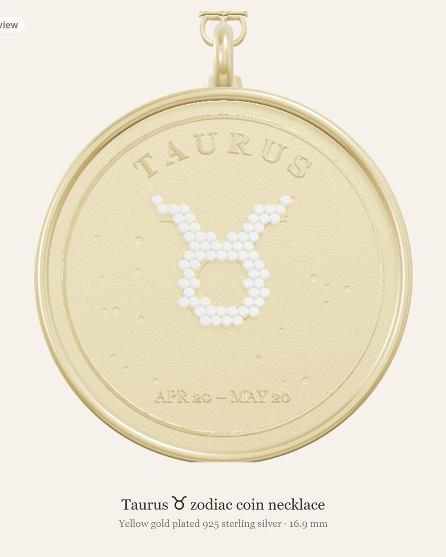 Front of the Taurus zodiac coin pendant in yellow gold plated 925 silver, with the Taurus glyph in lab-grown diamonds