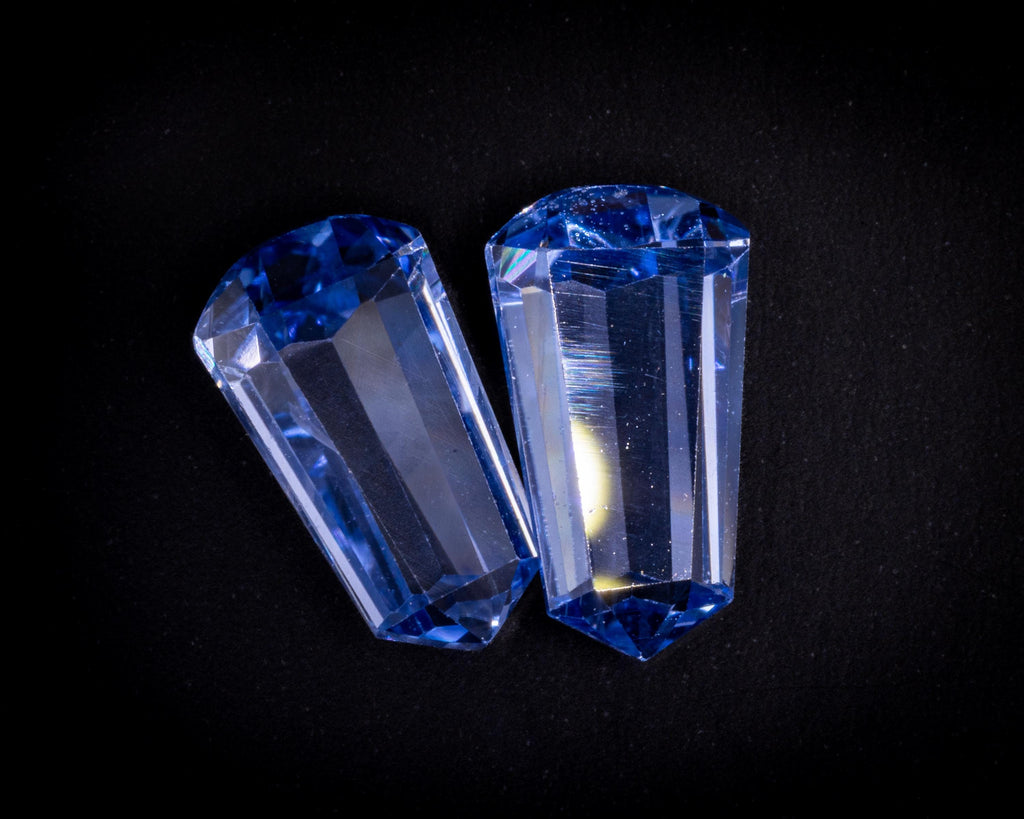 2.39 ct vintage blue sapphire bullet pair, tilted view of the long step facets