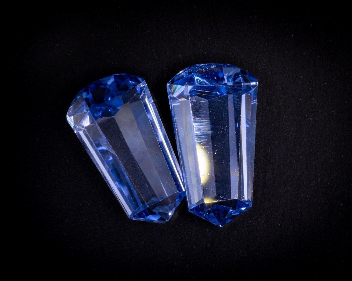 2.39 ct vintage blue sapphire bullet pair, tilted view of the long step facets