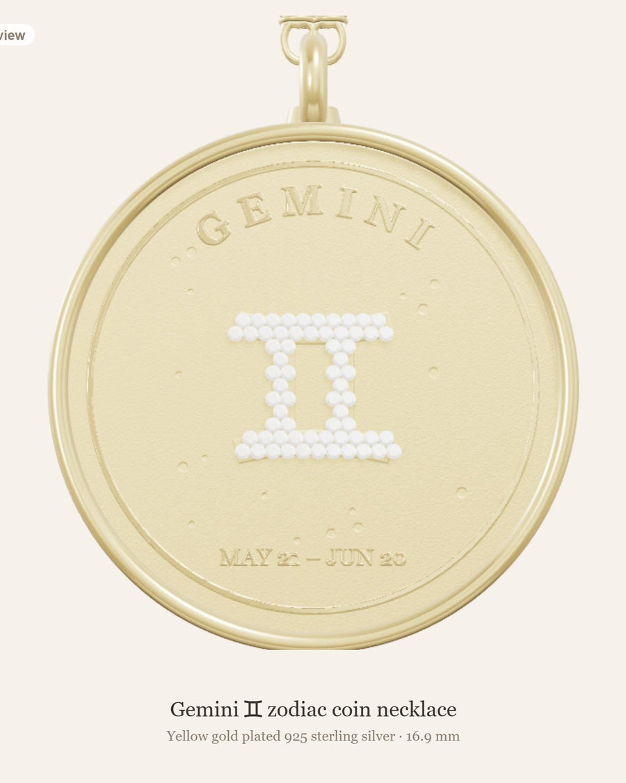 Front of the Gemini zodiac coin pendant in yellow gold plated 925 silver, with the Gemini glyph in lab-grown diamonds