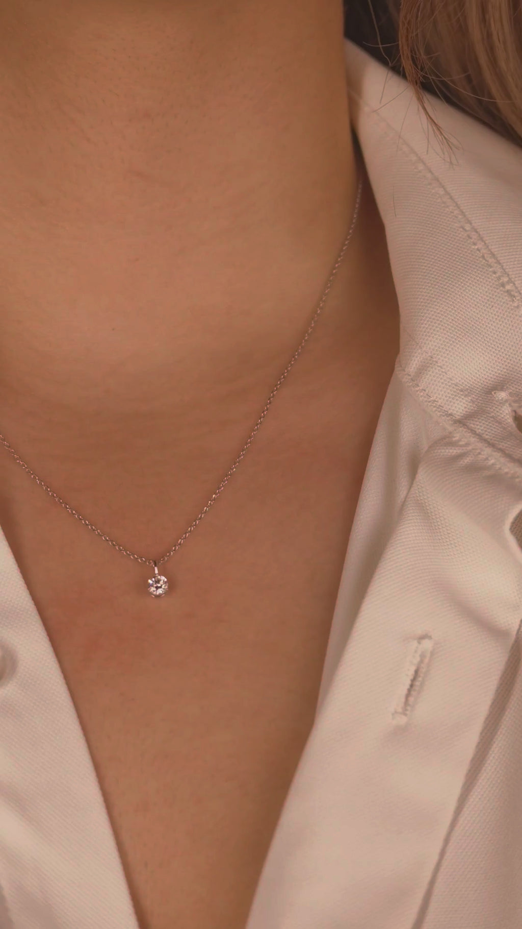 Video: white rhodium 0.50 ct solitaire necklace worn at the collarbone