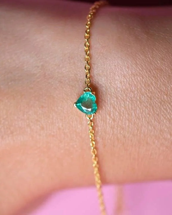 Yellow gold plated emerald heart bracelet on a fine polished cable chain