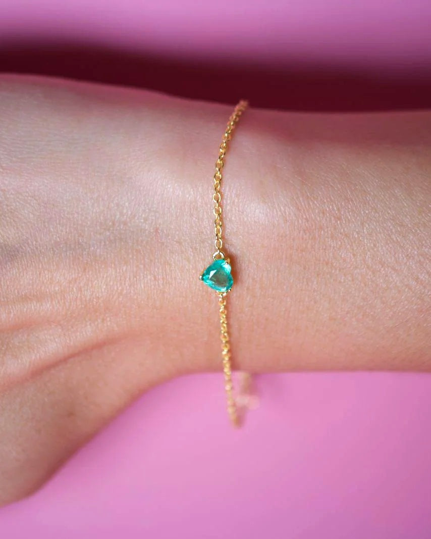 Natural emerald heart bracelet worn on the wrist, yellow gold plated sterling silver