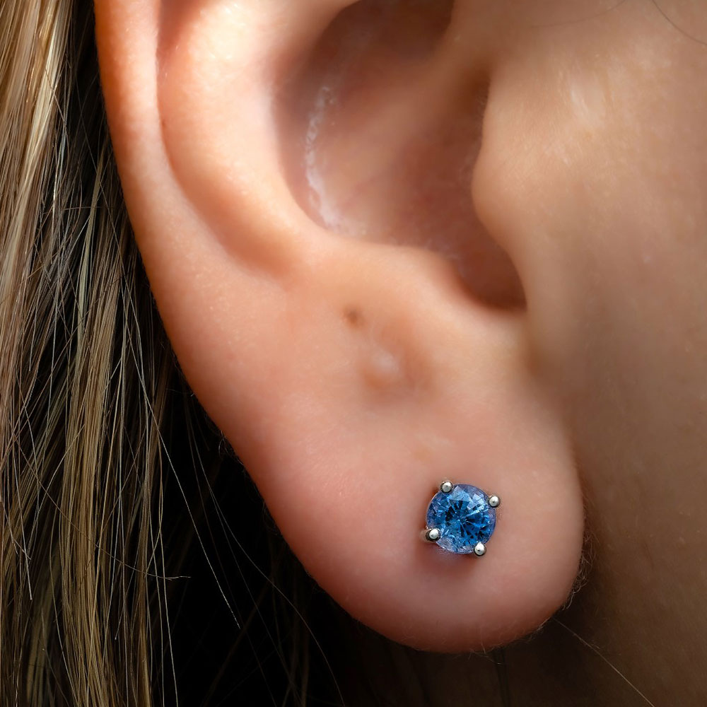 handcrafted_blue_sapphire_stud_earrings_white